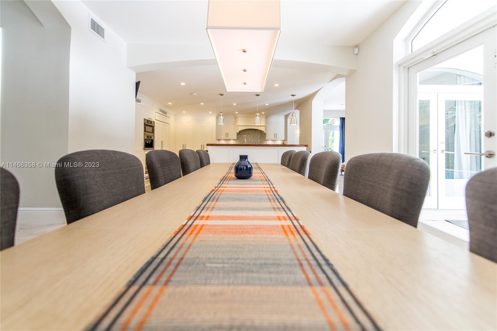 3500 Munroe Drive Coconut Grove, FL 33133 - Photo 17 of 54 a large bedroom with double bed and a large window