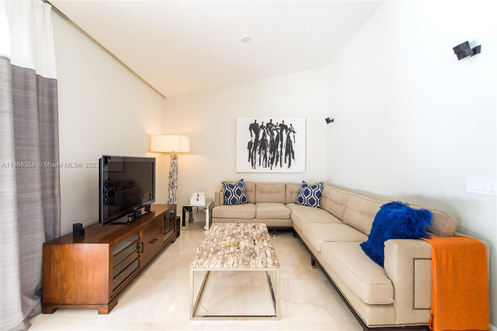 3500 Munroe Drive Coconut Grove, FL 33133 - Photo 20 of 54 a living room with furniture and a flat screen tv