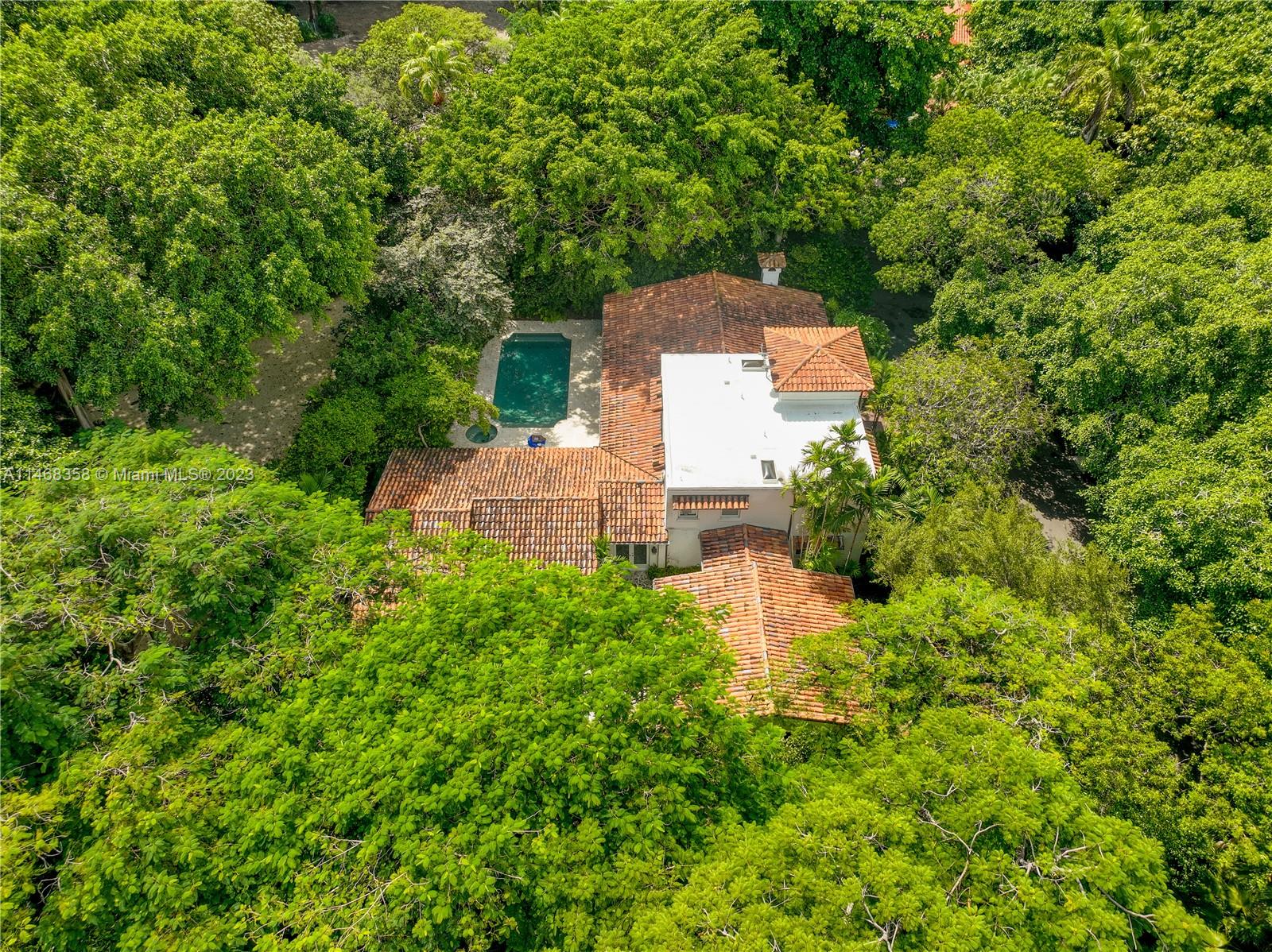 3500 Munroe Drive Coconut Grove, FL 33133 - Photo 2 of 54 a view of a house with a yard and a garden