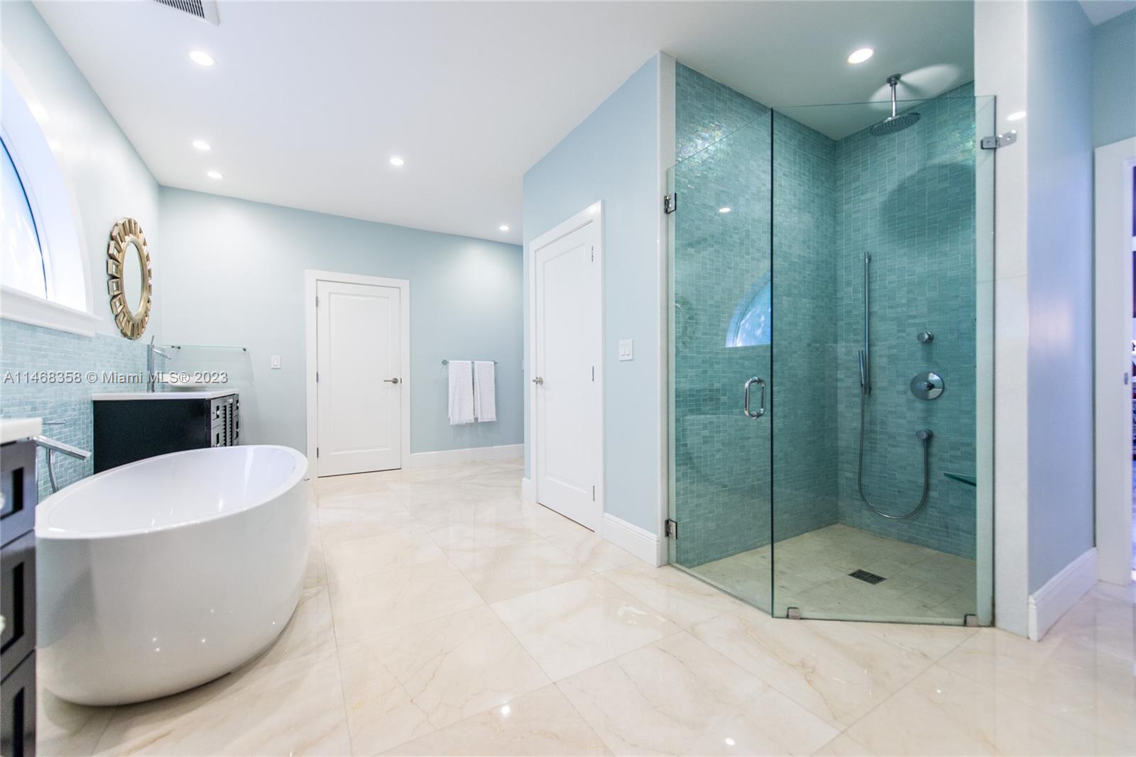 3500 Munroe Drive Coconut Grove, FL 33133 - Photo 30 of 54 a bathroom with a bathtub and shower