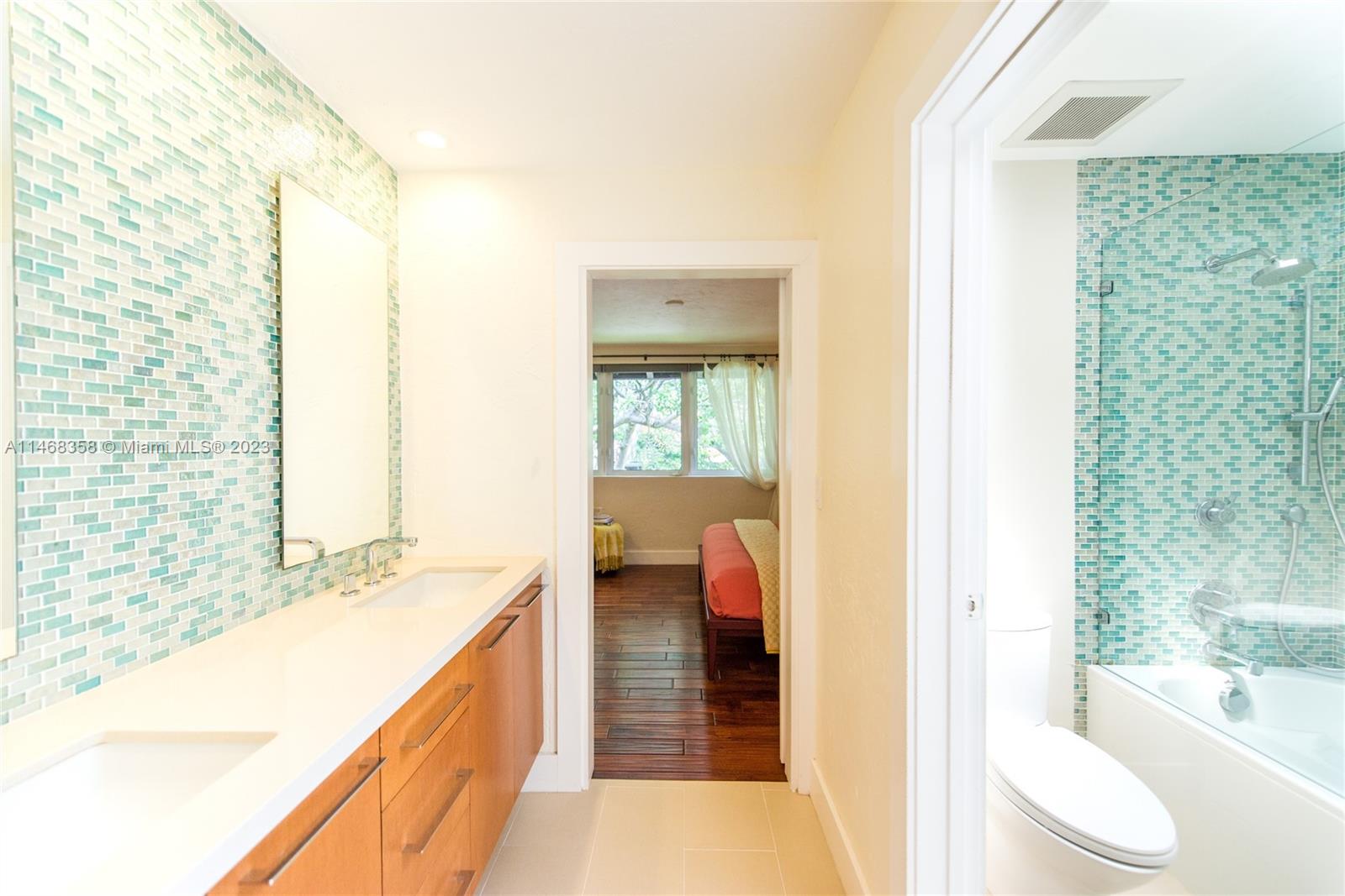 3500 Munroe Drive Coconut Grove, FL 33133 - Photo 34 of 54 a bathroom with a sink a toilet and shower