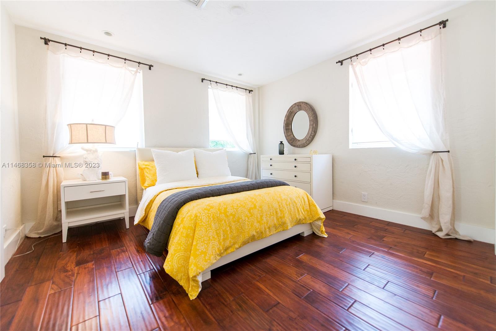 3500 Munroe Drive Coconut Grove, FL 33133 - Photo 36 of 54 a bedroom with a bed and wooden floor