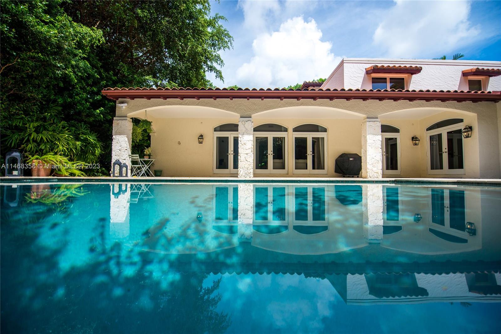3500 Munroe Drive Coconut Grove, FL 33133 - Photo 40 of 54 a front view of a house with a yard
