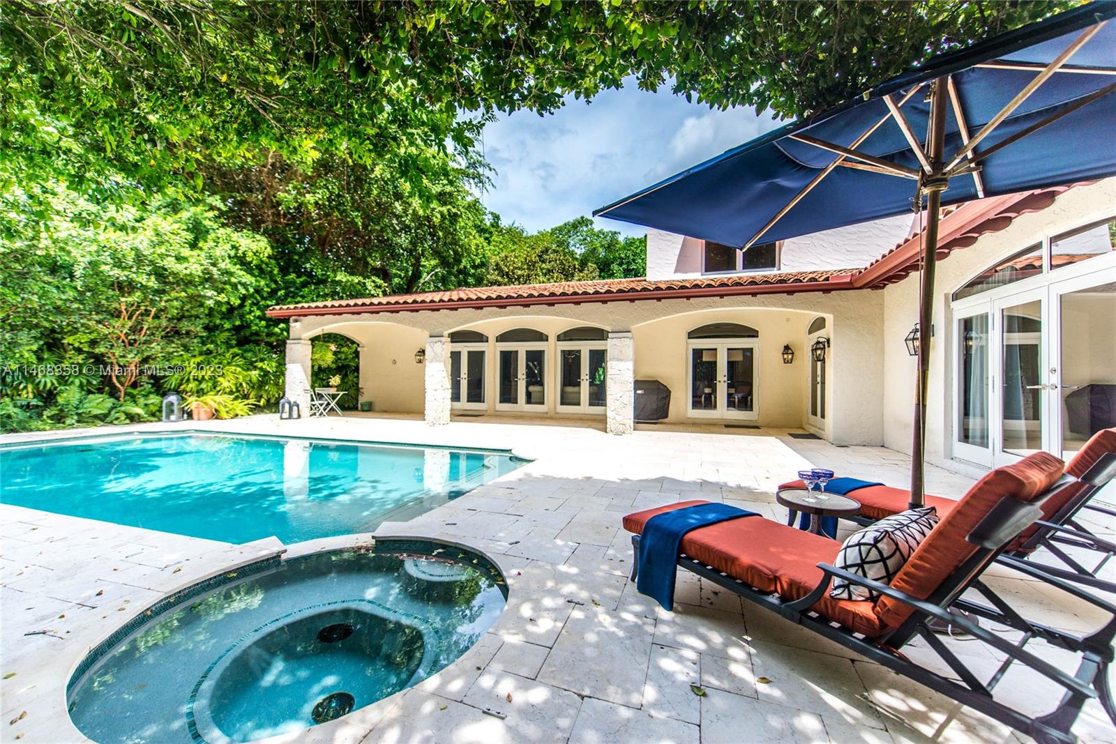 3500 Munroe Drive Coconut Grove, FL 33133 - Photo 41 of 54 a backyard of a house with table and chairs