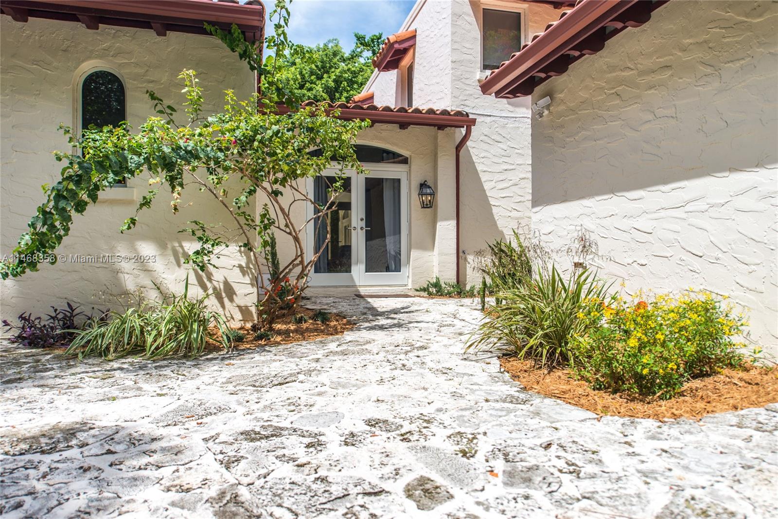 3500 Munroe Drive Coconut Grove, FL 33133 - Photo 45 of 54 a front view of a house with garden