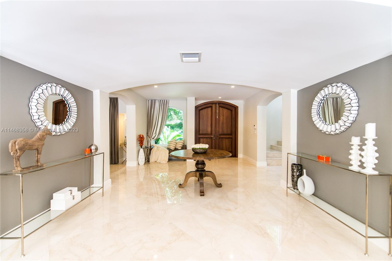 3500 Munroe Drive Coconut Grove, FL 33133 - Photo 5 of 54 a view of a livingroom with furniture and a mirror