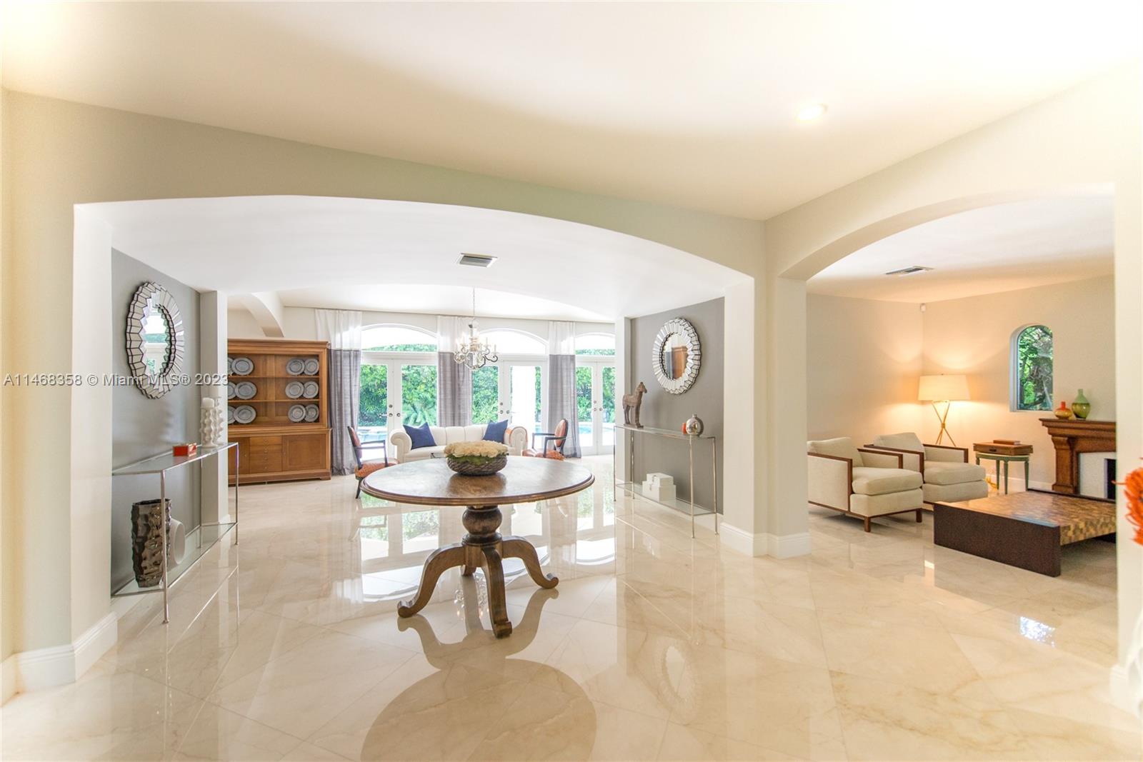3500 Munroe Drive Coconut Grove, FL 33133 - Photo 6 of 54 a living room with furniture and a fireplace