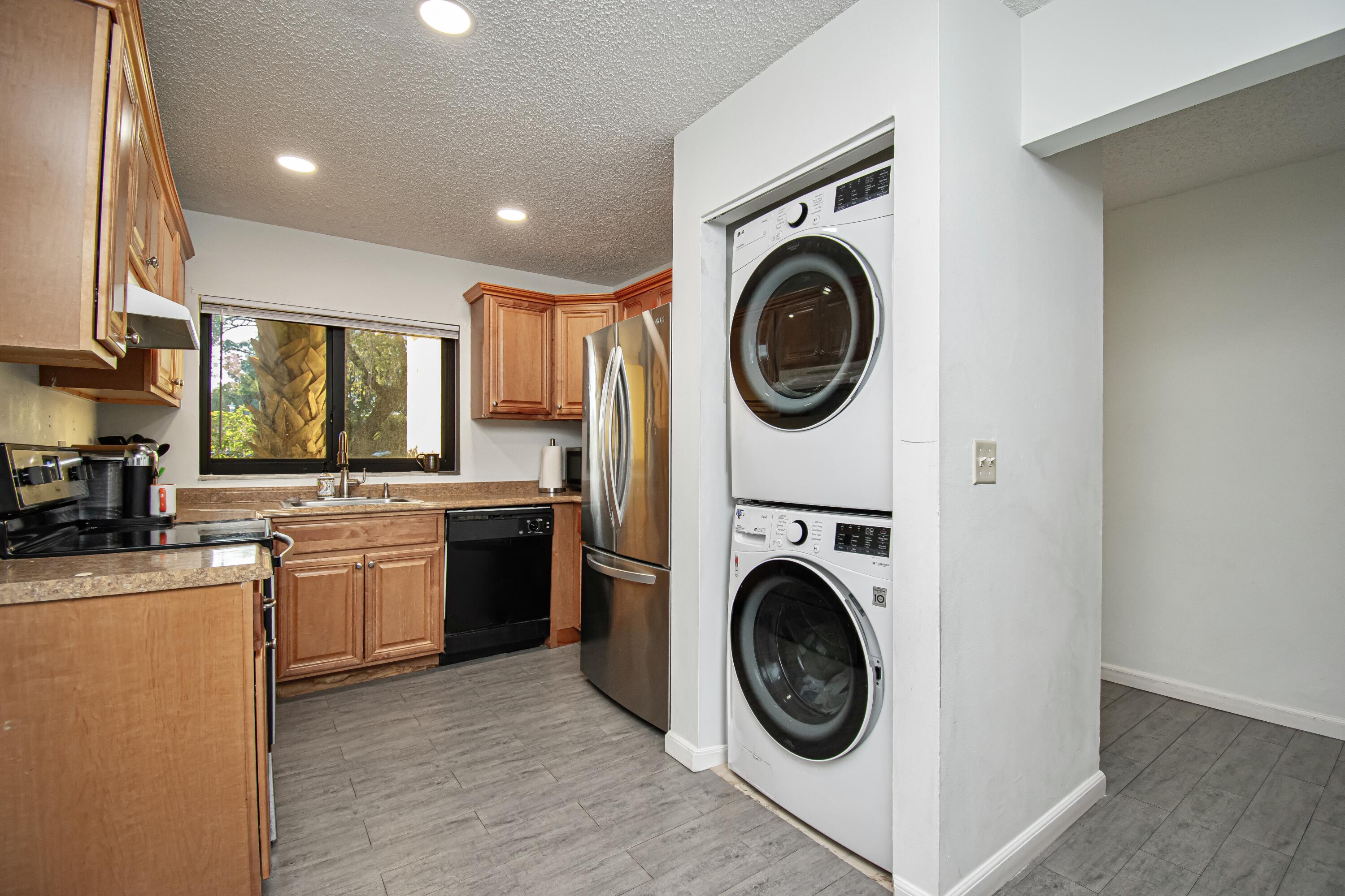 6825 Bridlewood Court Boca Raton, FL 33433 - Photo 13 of 31 a view of a kitchen with washer and dryer