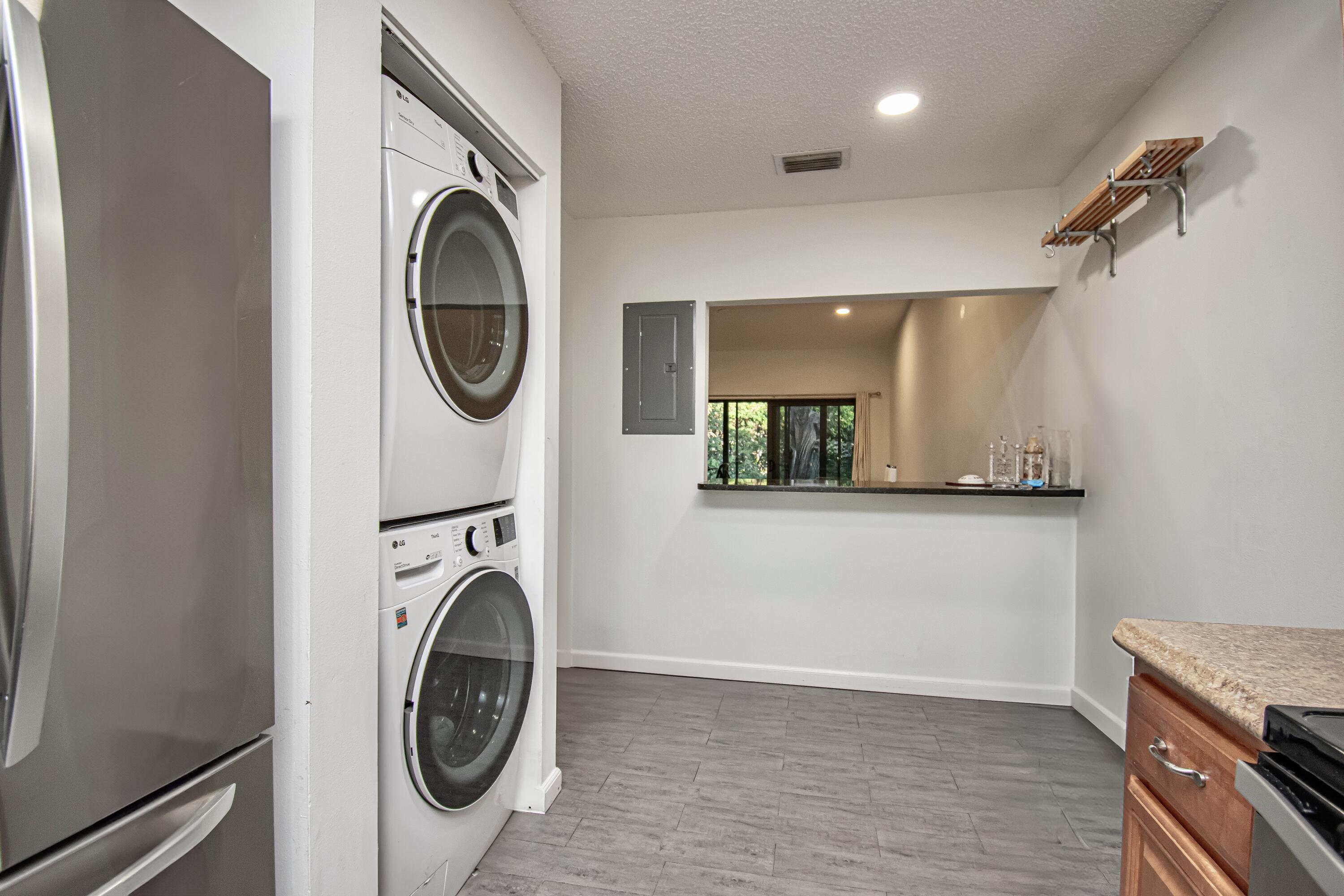 6825 Bridlewood Court Boca Raton, FL 33433 - Photo 14 of 31 a view of a hallway with washer and dryer