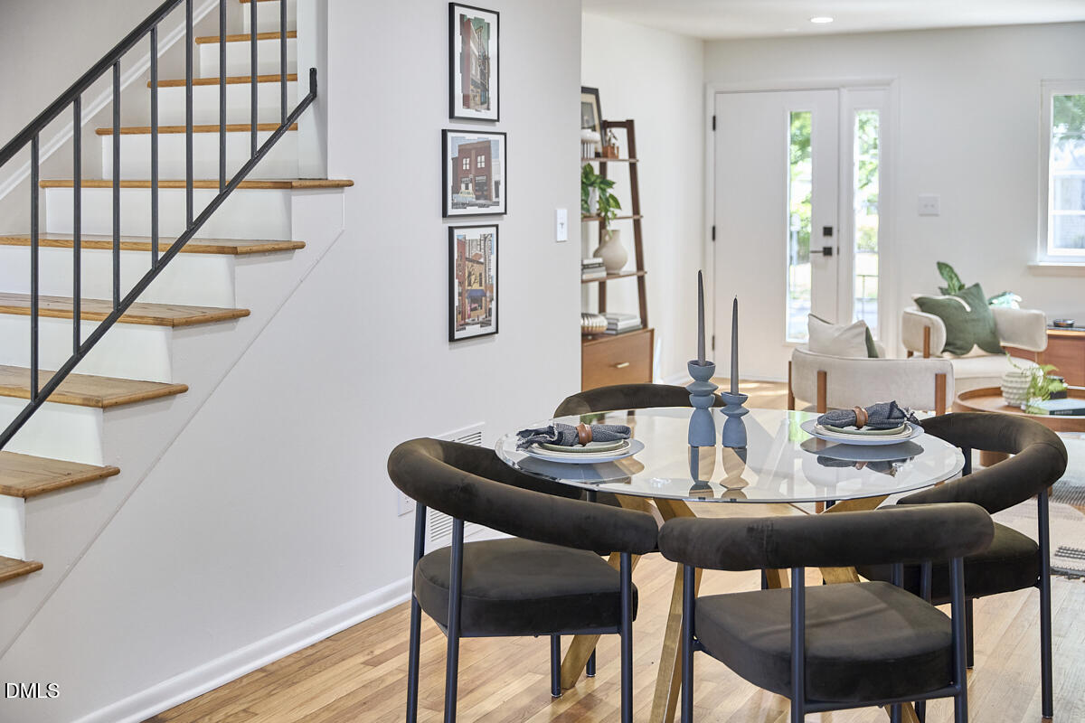 2613 McNeil Street, Unit E Raleigh, NC 27608 - Photo 9 of 28 a view of a dining room with furniture and wooden floor