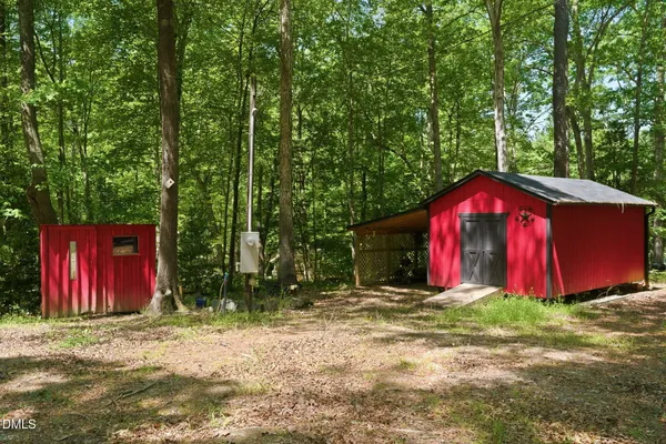 a view of a barn with big yard