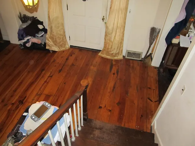 a view of an entryway with wooden floor