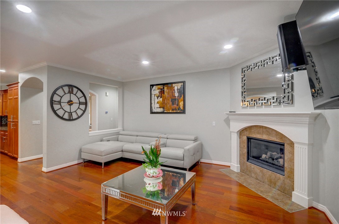 1217 South 36th Place Renton, WA 98055 - Photo 11 of 30 a living room with furniture and a fireplace