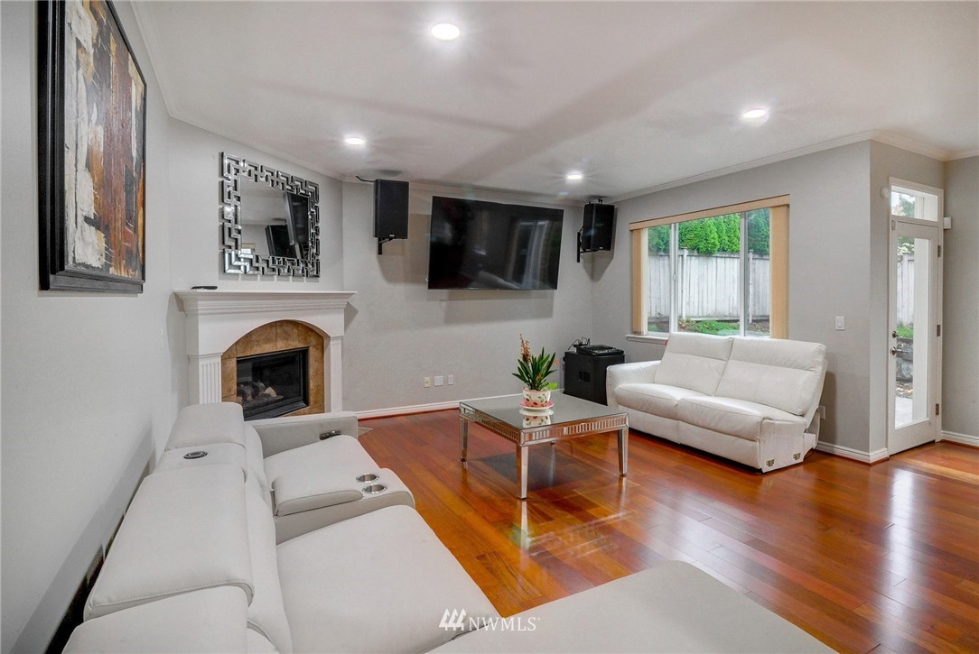 1217 South 36th Place Renton, WA 98055 - Photo 12 of 30 a living room with furniture fireplace and window
