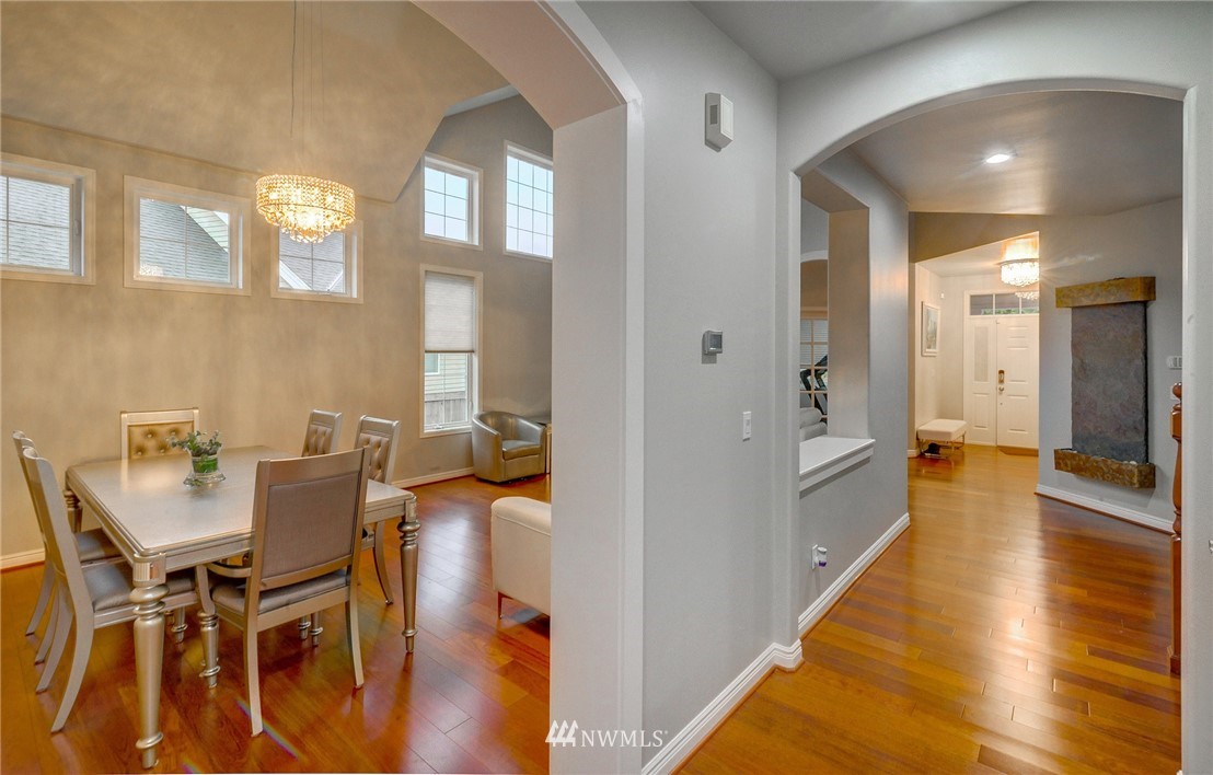 1217 South 36th Place Renton, WA 98055 - Photo 13 of 30 a view of a dining room with furniture and wooden floor