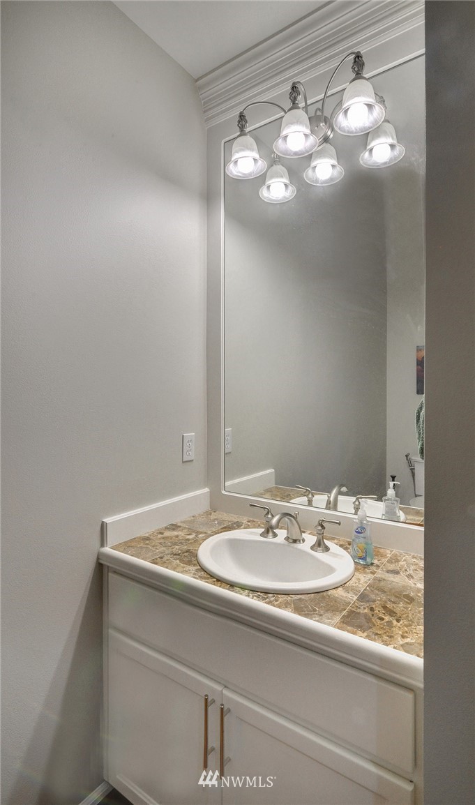 1217 South 36th Place Renton, WA 98055 - Photo 15 of 30 a bathroom with a sink and a mirror