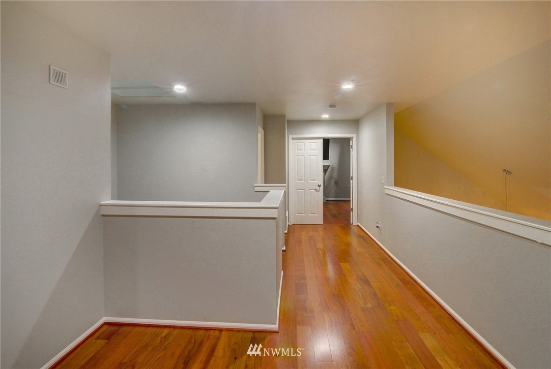1217 South 36th Place Renton, WA 98055 - Photo 22 of 30 a view of empty room with wooden floor