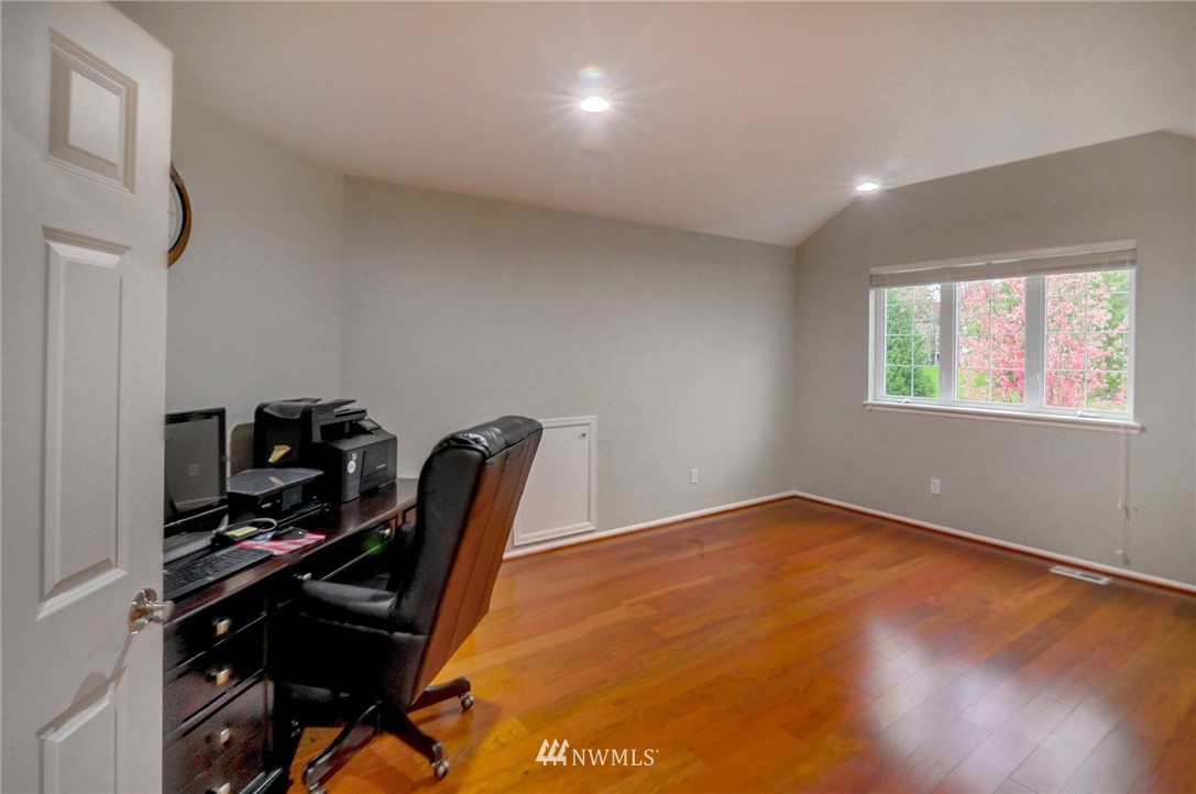 1217 South 36th Place Renton, WA 98055 - Photo 23 of 30 a view of a workspace with furniture and a window