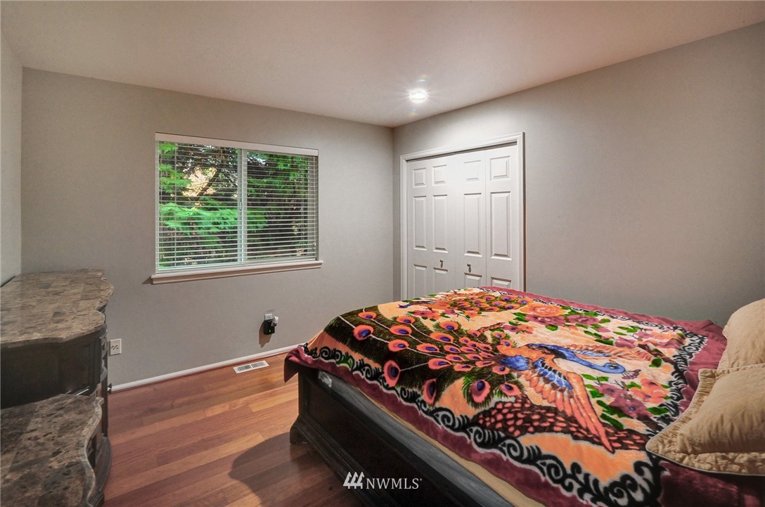 1217 South 36th Place Renton, WA 98055 - Photo 27 of 30 a bedroom with bed and window