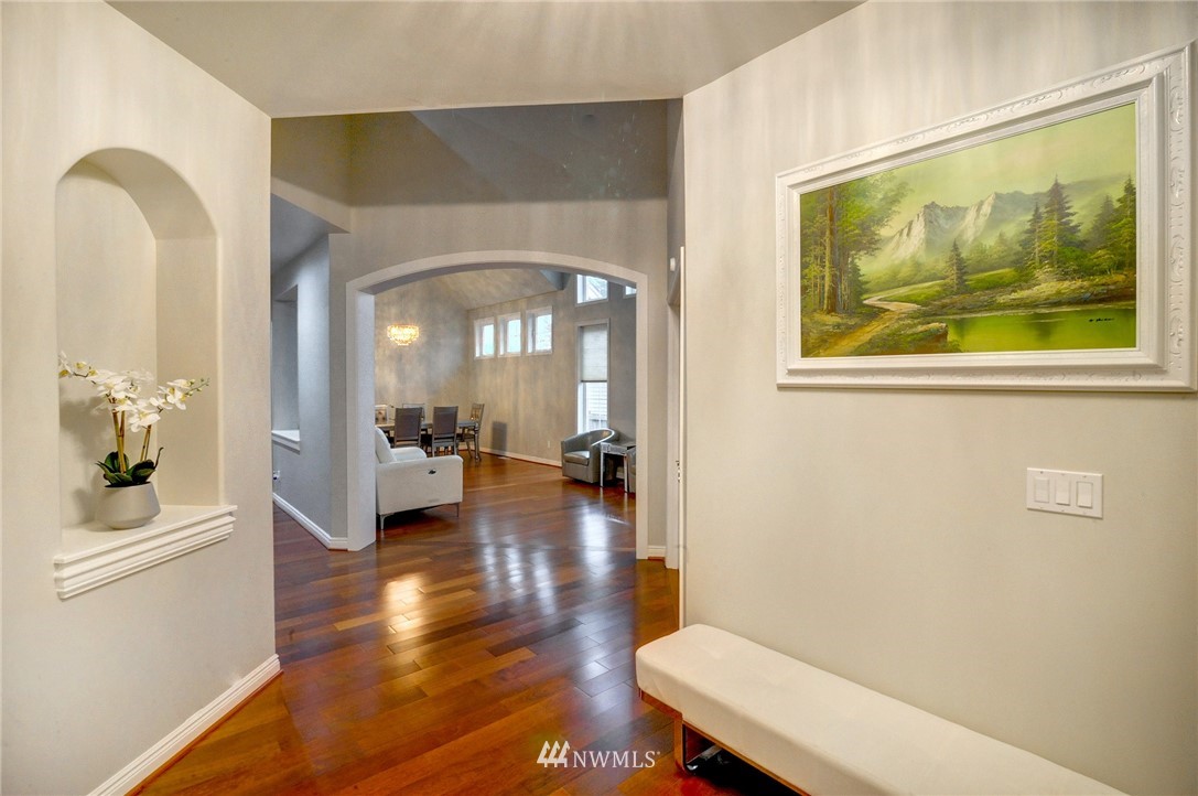 1217 South 36th Place Renton, WA 98055 - Photo 4 of 30 a living room with furniture and a painting on the wall