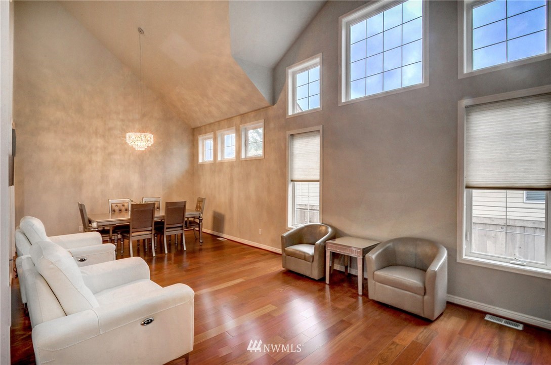 1217 South 36th Place Renton, WA 98055 - Photo 5 of 30 a living room with furniture and a window
