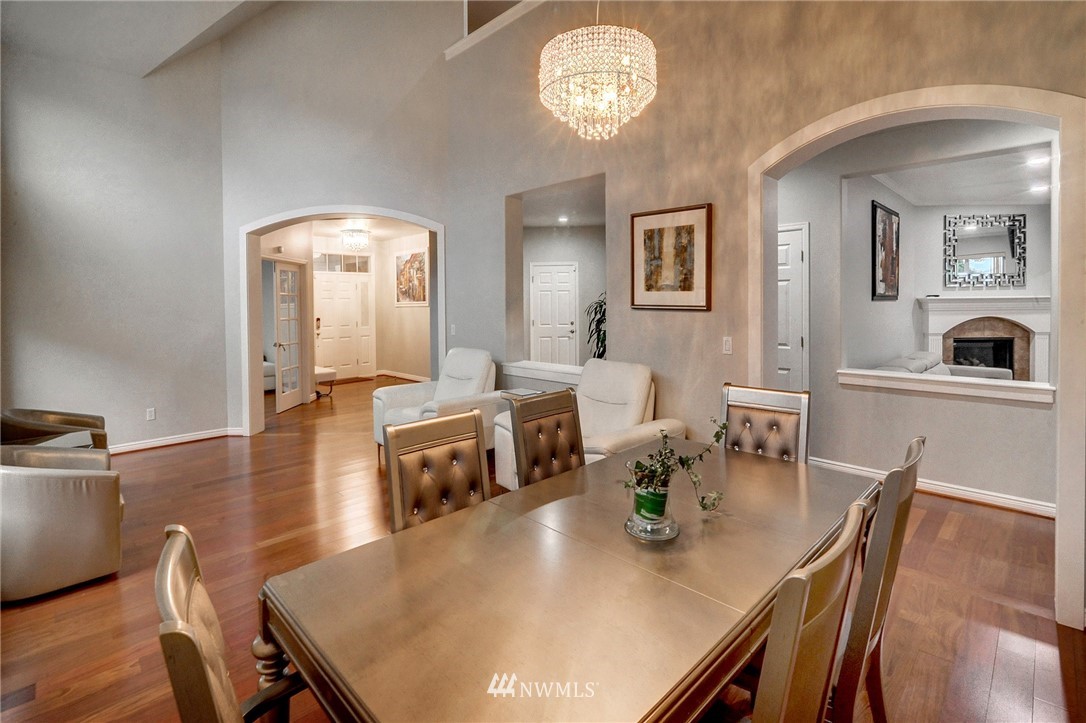 1217 South 36th Place Renton, WA 98055 - Photo 6 of 30 a view of a dining room with furniture and wooden floor