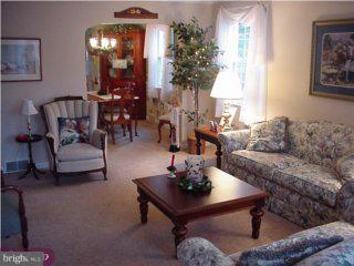 139 Schuyler Road Springfield, PA 19064 - Photo 2 of 3 a living room with furniture and a potted plant