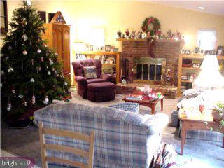 139 Schuyler Road Springfield, PA 19064 - Photo 3 of 3 a view of a patio with couches and table and chairs and potted plants