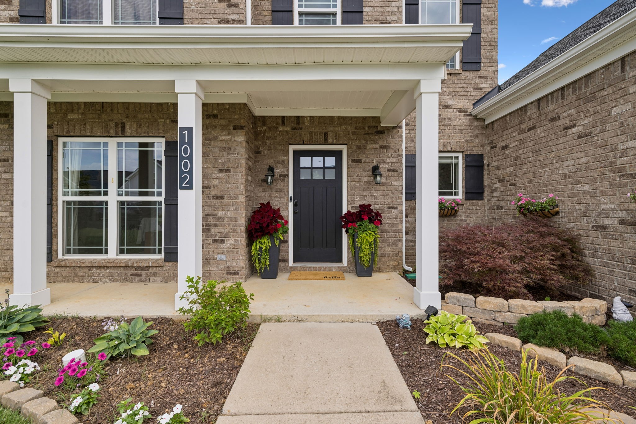 1002 Garrison Way Spring Hill, TN 37174 - Photo 5 of 63 a front view of a house with an outdoor space