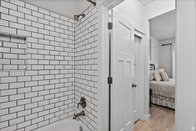 681 Island Road Morgan, UT 84050 - Photo 14 of 49 White subway tile shower surround with a built-in niche and bronze-finish fixtures