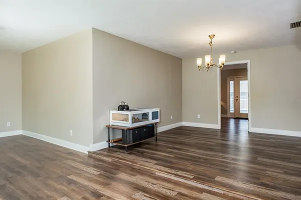 a bed room with a bed and a mirror