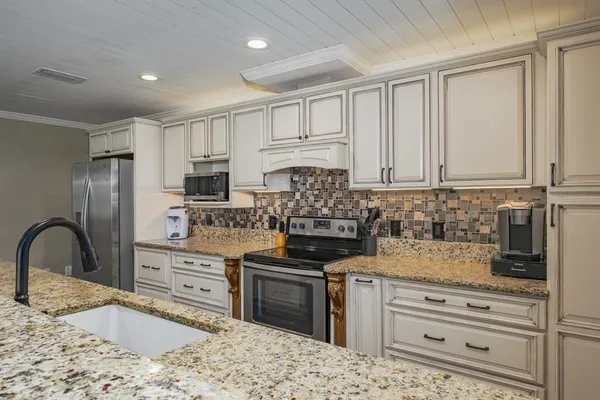 a bedroom with a bed and a television