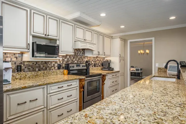 a bedroom with a bed and flat screen tv