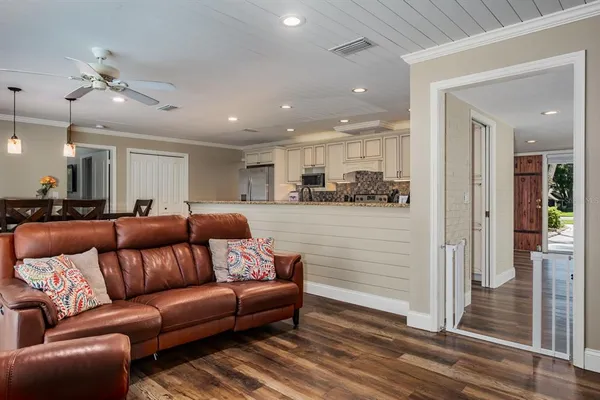 a bathroom with a shower sink vanity mirror and toilet