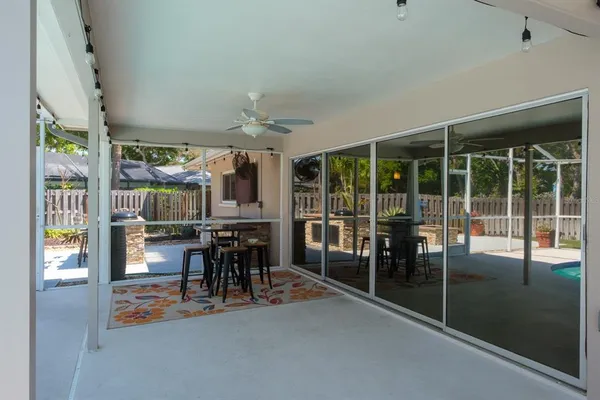 a view of a backyard with swimming pool