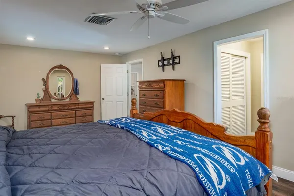 a kitchen with a table chairs a stove and a microwave