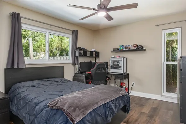 an aerial view of a house with a garden and swimming pool