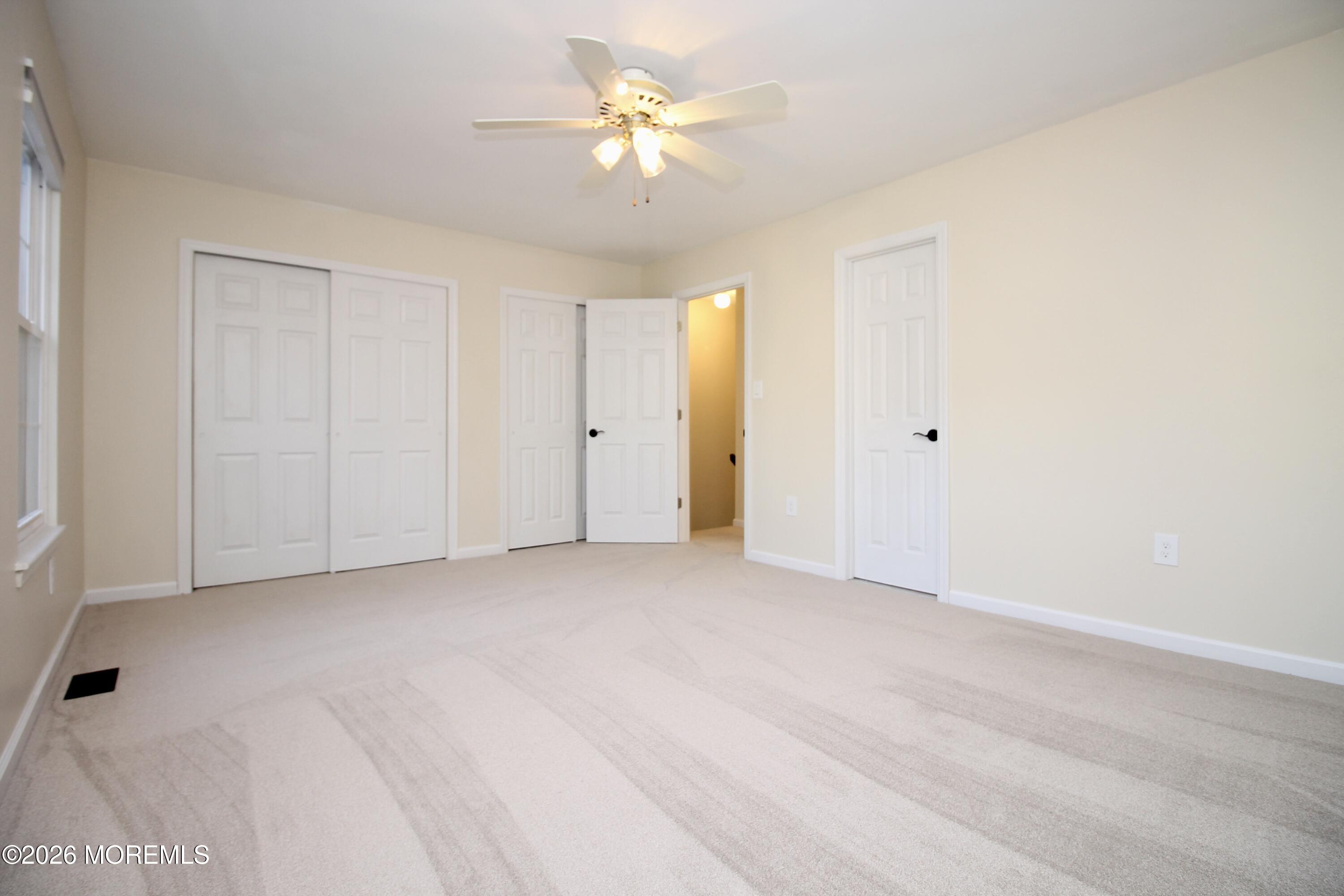 5-2 Claridge Court, Unit 2 Freehold, NJ 07728 - Photo 25 of 35 a view of an empty room with a window