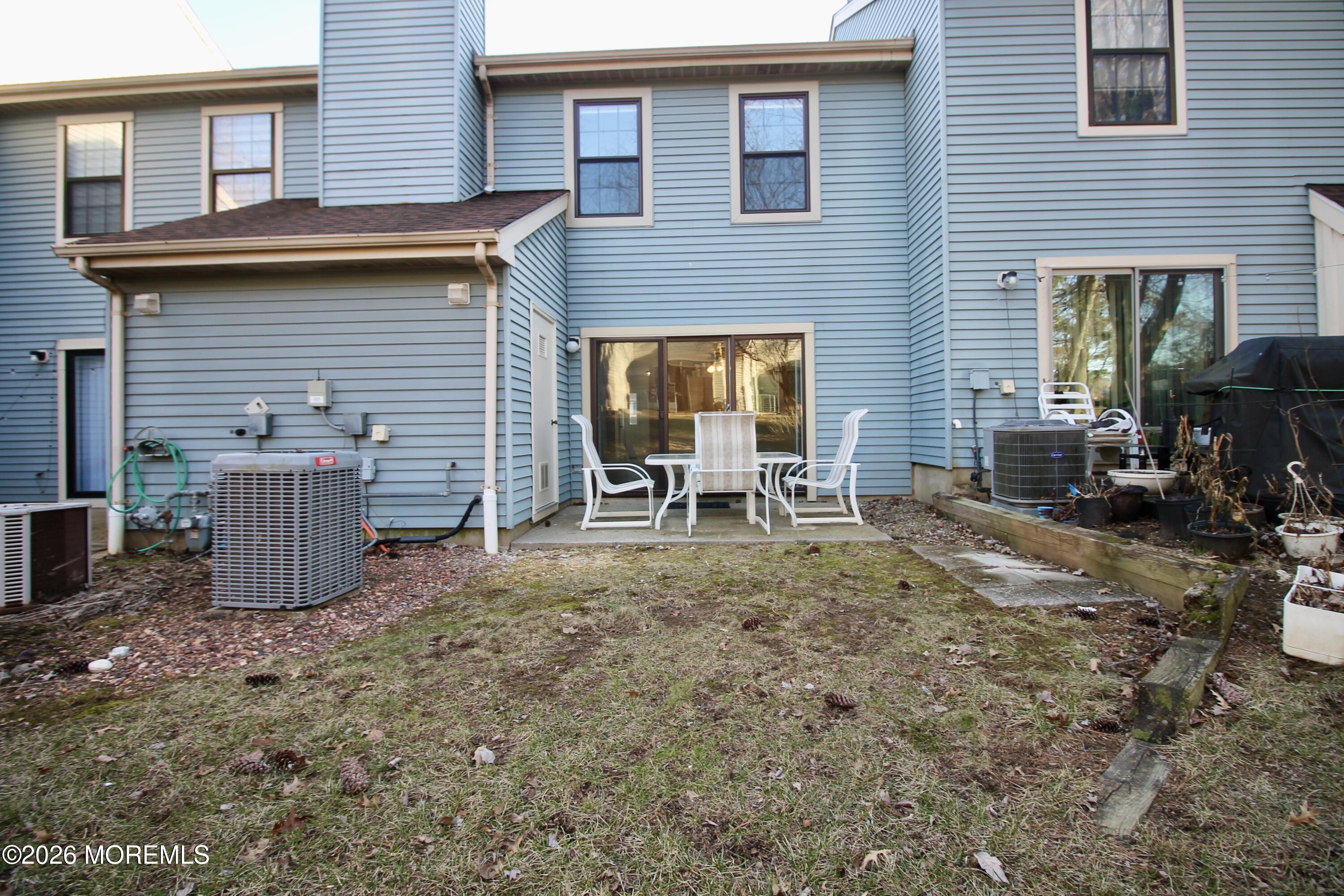 5-2 Claridge Court, Unit 2 Freehold, NJ 07728 - Photo 35 of 35 a view of a house with backyard and sitting area