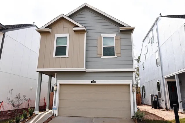 a front view of a house with many windows