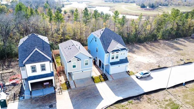 an aerial view of a house with outdoor space