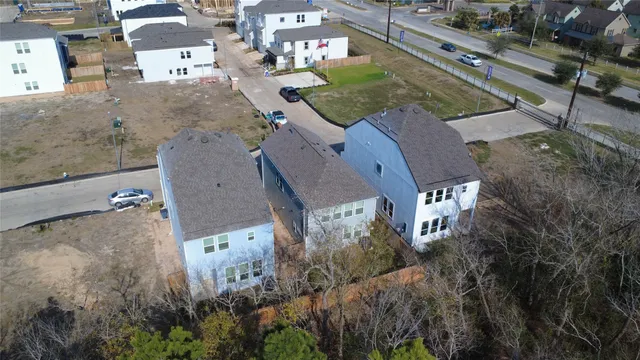 an aerial view of a house with outdoor space and street view