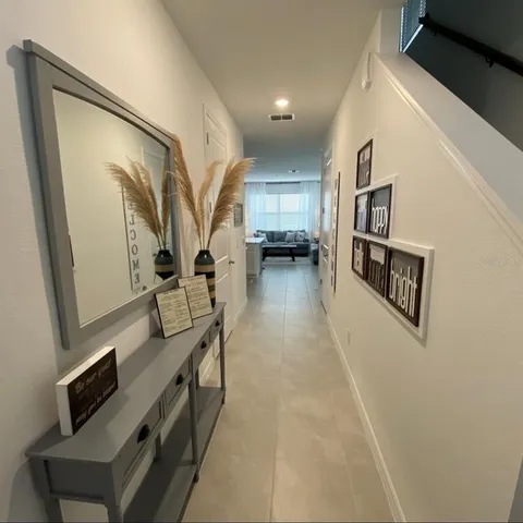a view of living room with furniture and a flat screen tv