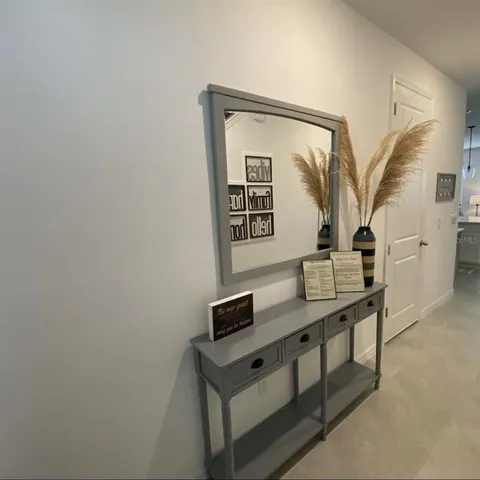 a view of hallway with furniture