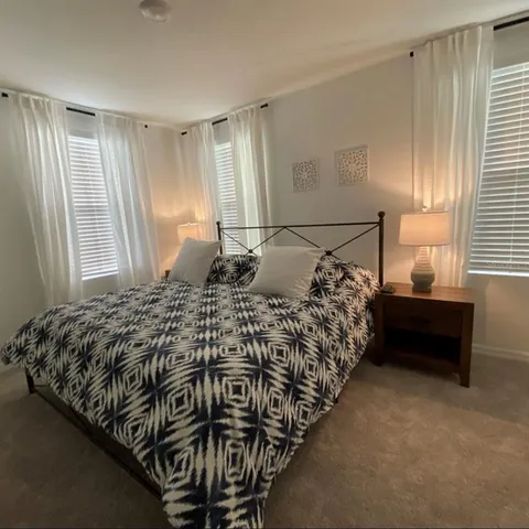 a bathroom with a double vanity sink and mirror