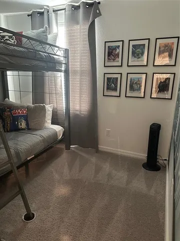 a kitchen with kitchen island granite countertop a stove a sink and a refrigerator