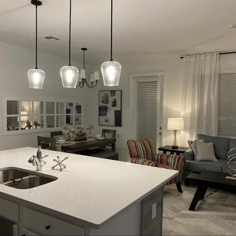 a room with a chandelier a sink and a chandelier