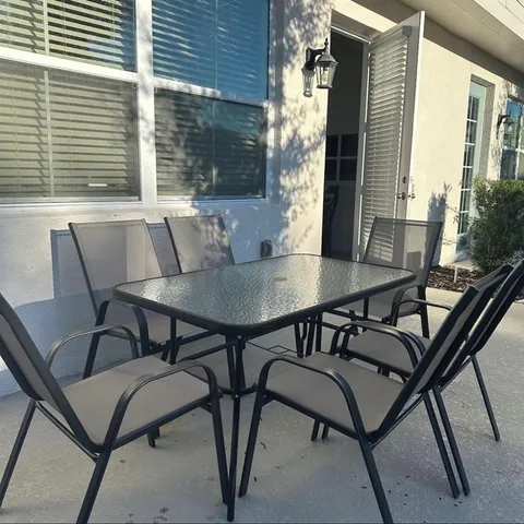 a view of a balcony with chairs