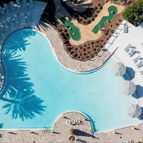 a view of a chairs and table in a backyard