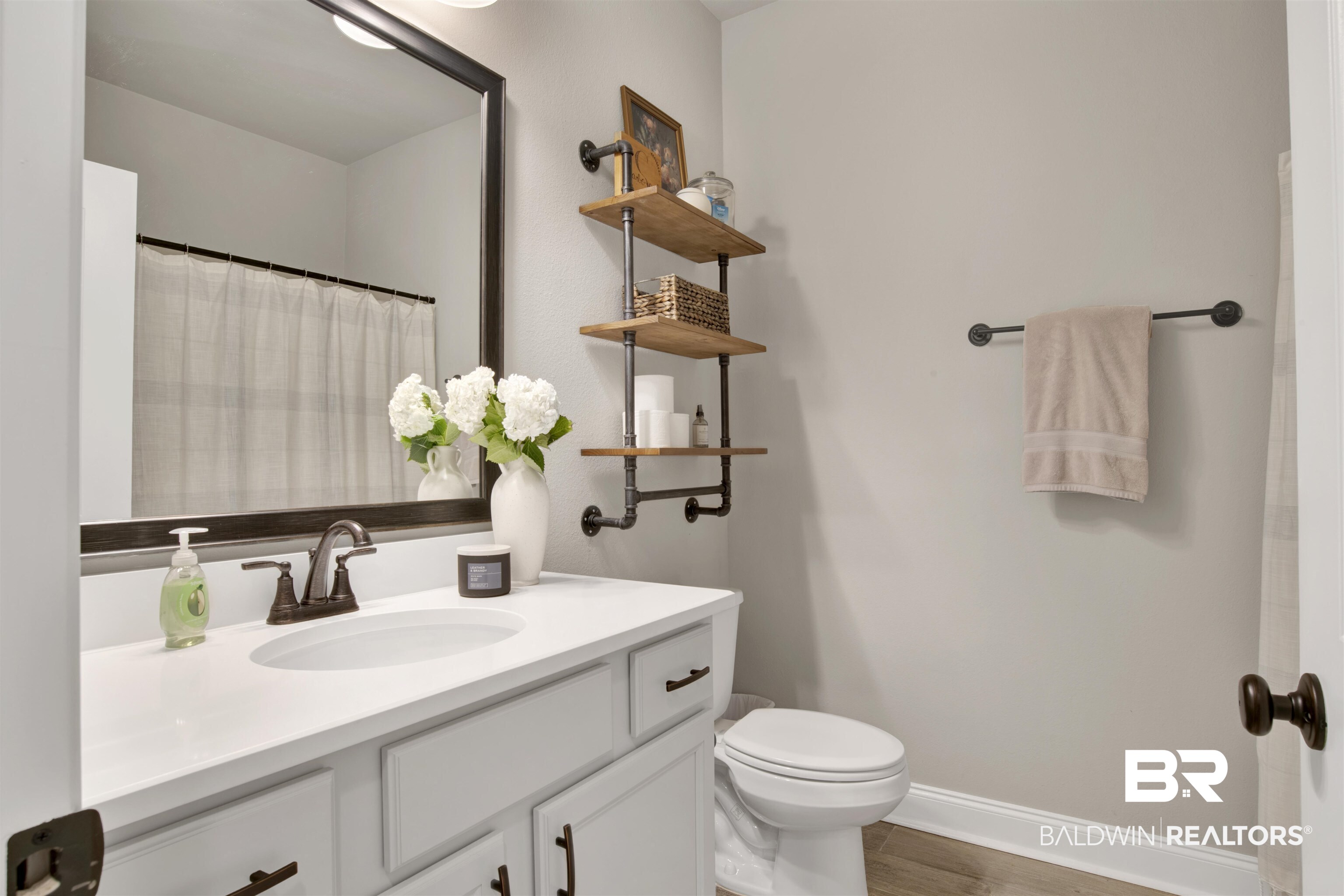 30770 Marcel Boulevard Spanish Fort, AL 36527 - Photo 20 of 23 Bathroom featuring vanity, toilet, and hardwood / wood-style flooring